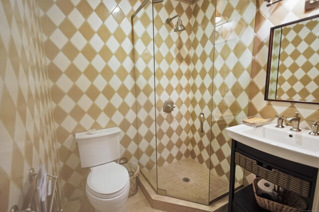 bathroom with an enclosed shower, toilet, and vanity