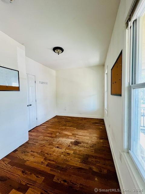 spare room with wood finished floors