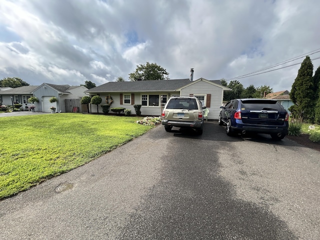 single story home featuring a front yard