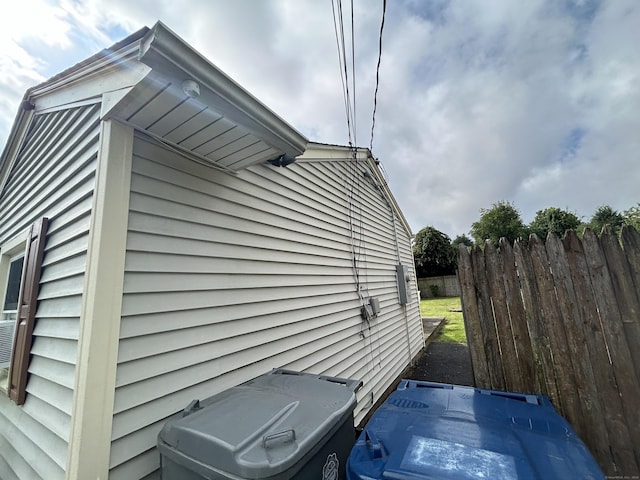 view of home's exterior with fence