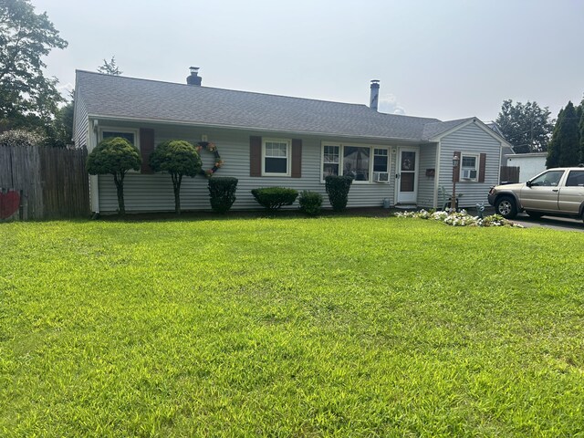 single story home featuring a front yard