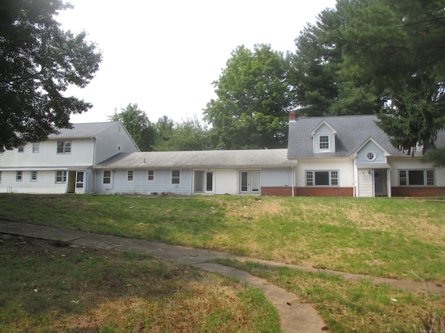 view of front of home with a front yard