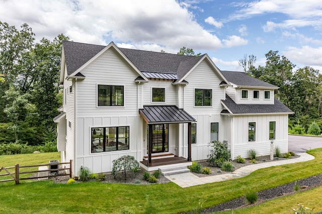 modern farmhouse featuring a front lawn