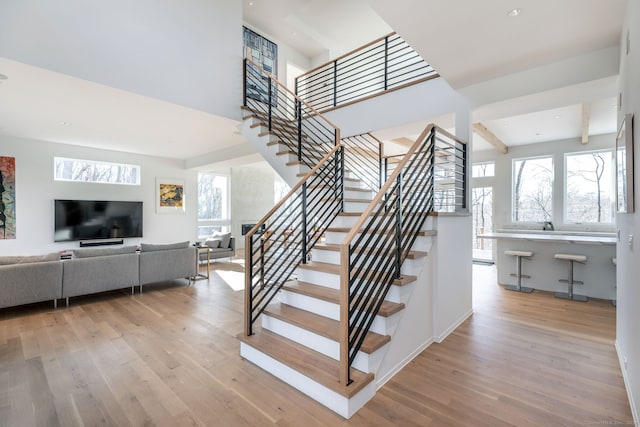 stairs with hardwood / wood-style floors