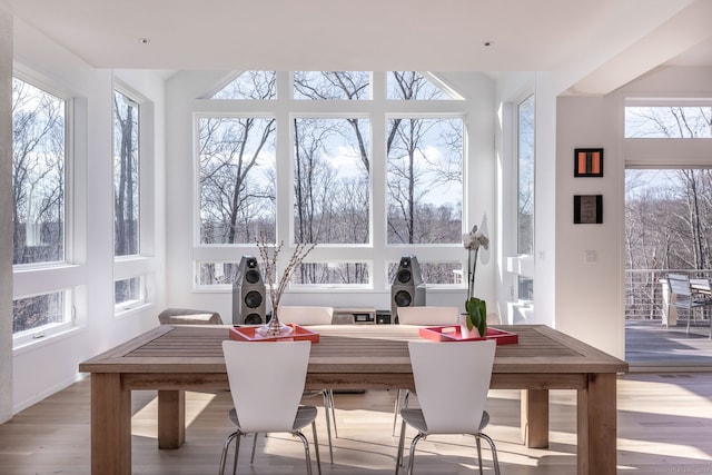 sunroom / solarium featuring a healthy amount of sunlight