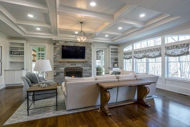 living room featuring a fireplace, dark wood-type flooring, coffered ceiling, and built in features