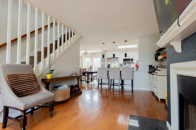 interior space with hardwood / wood-style floors and a notable chandelier