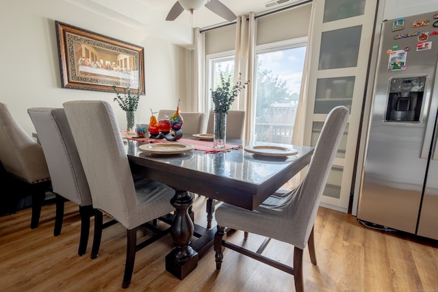 dining room featuring light wood-type flooring and ceiling fan