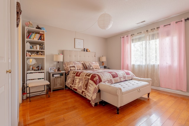 bedroom with light hardwood / wood-style flooring