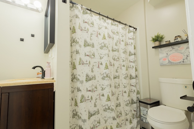 bathroom with vanity, toilet, and a shower with shower curtain