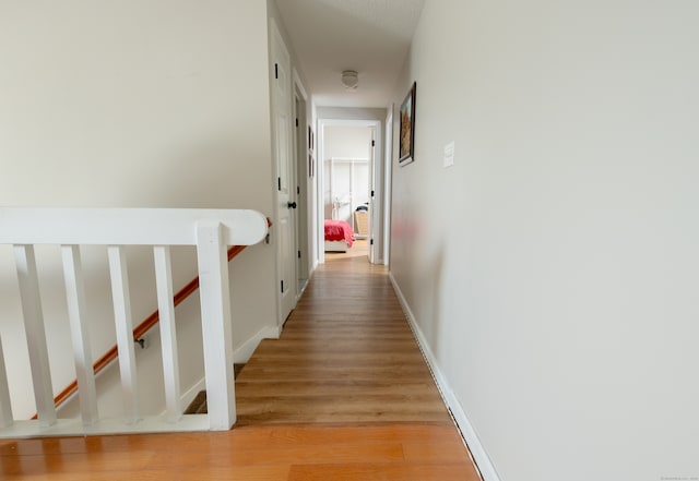 hall with light wood-type flooring