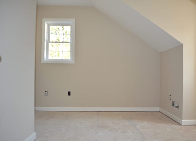 additional living space with vaulted ceiling