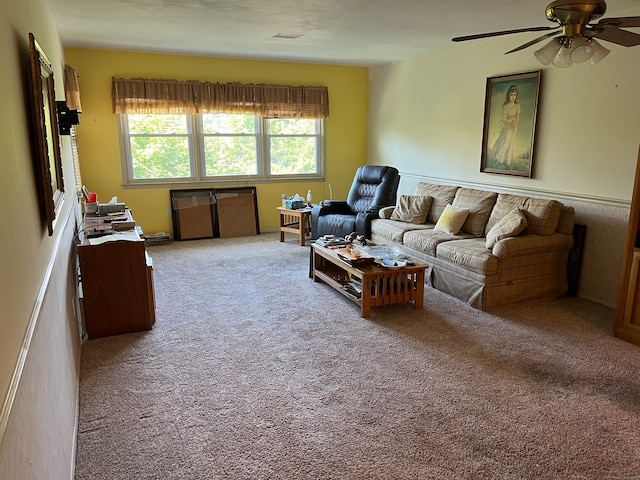 living room featuring carpet flooring and ceiling fan