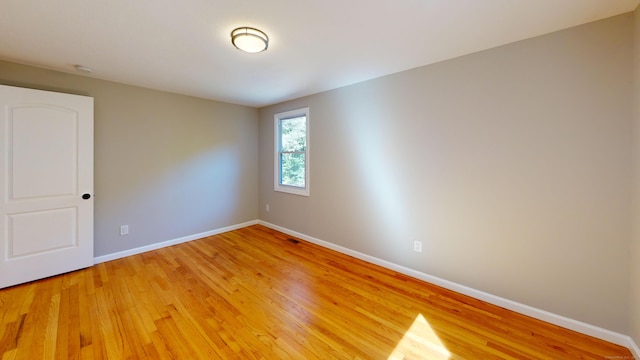 unfurnished room featuring light hardwood / wood-style floors