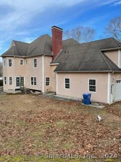 back of house with a garage