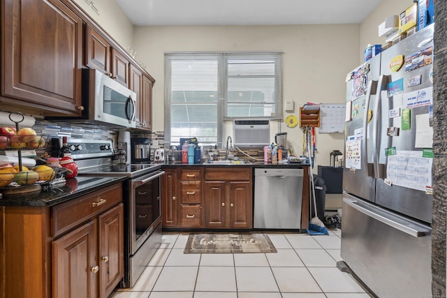5 Hundley Ct Apt 1C, Stamford, CT 06902 - kitchen with appliances with stainless steel finishes, light tile patterned floors, tasteful backsplash, and cooling unit