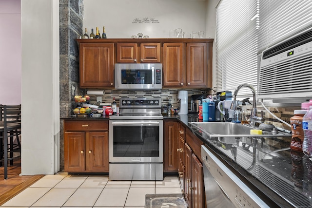 5 Hundley Ct Apt 1C, Stamford, CT 06902 - kitchen with stainless steel appliances, dark countertops, tasteful backsplash, and light tile patterned flooring