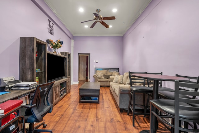 office area featuring crown molding, wood-type flooring, and ceiling fan