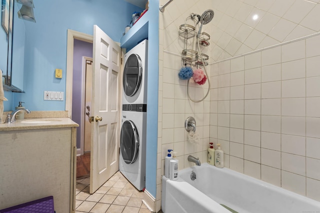5 Hundley Ct Apt 1C, Stamford, CT 06902 - bathroom with stacked washer and clothes dryer, vanity, tile patterned flooring, and bathtub / shower combination