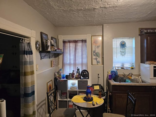 dining area with a textured ceiling