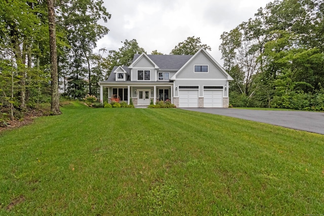 view of front of home featuring a front yard and covered porch