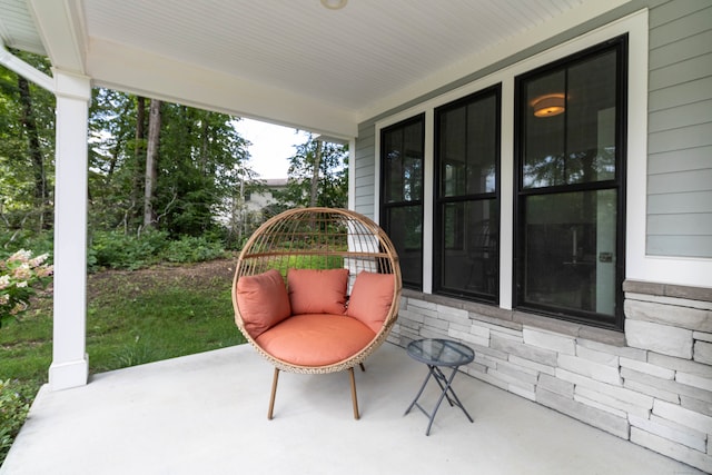 view of patio featuring a porch