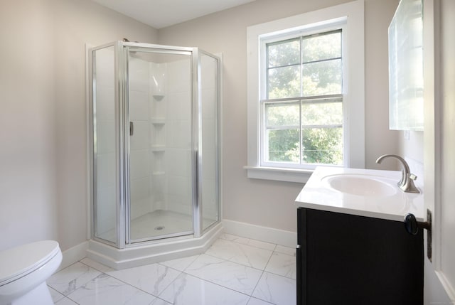 full bathroom featuring marble finish floor, a shower stall, vanity, and baseboards