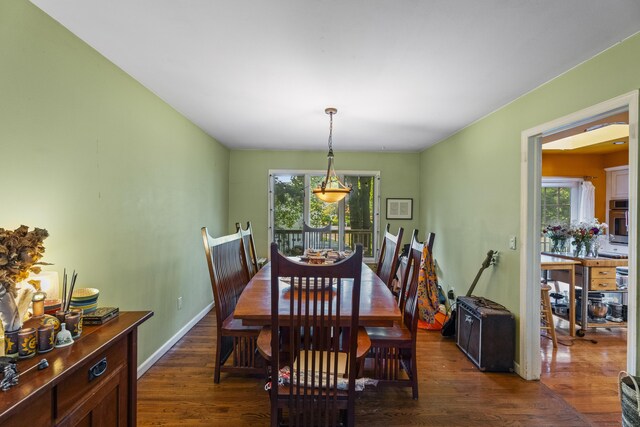 110 William St, Norwalk, CT 06851 - dining area with plenty of natural light, dark wood-style flooring, and baseboards