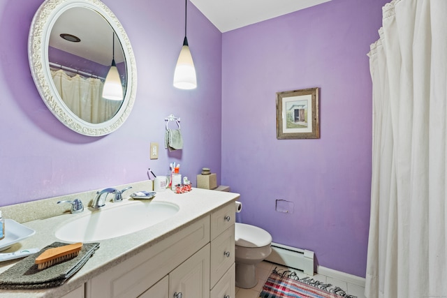 bathroom with a baseboard heating unit, vanity, toilet, and tile patterned flooring