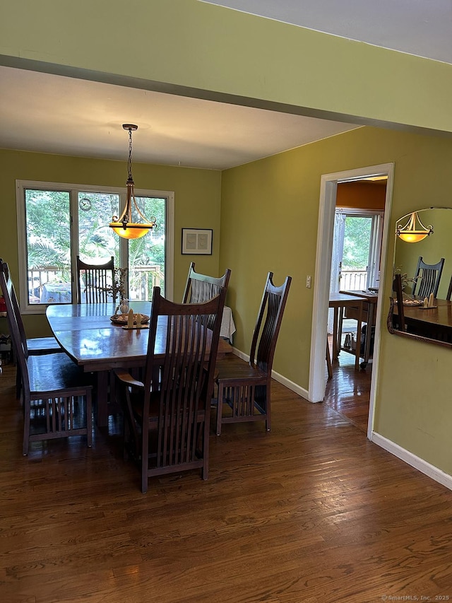 110 William St, Norwalk, CT 06851 - dining area with dark wood-type flooring and baseboards
