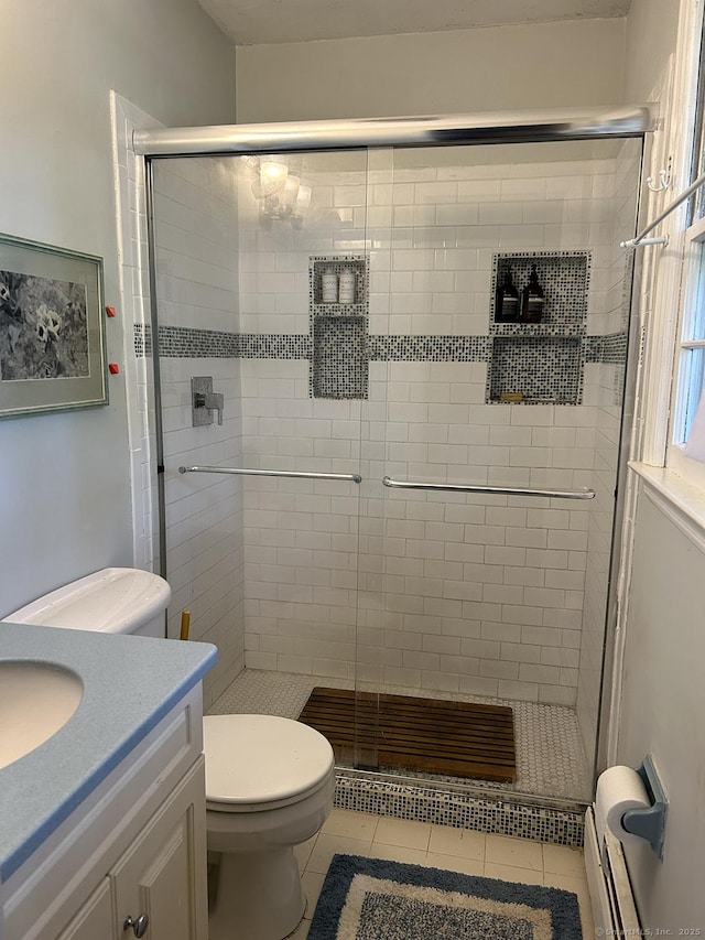 110 William St, Norwalk, CT 06851 - full bath featuring vanity, tile patterned floors, a stall shower, and a baseboard radiator