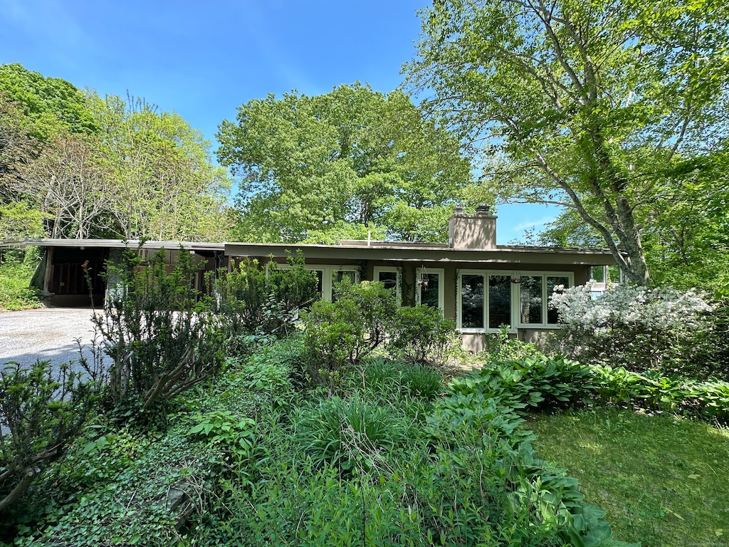 ranch-style home with a carport