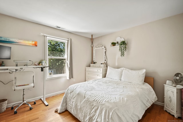 bedroom featuring hardwood / wood-style flooring