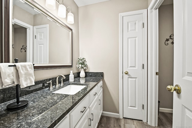 bathroom with vanity and wood-type flooring