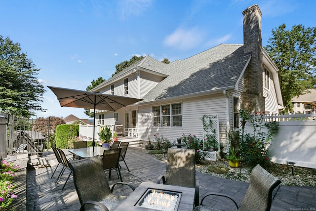 view of patio / terrace featuring a fire pit