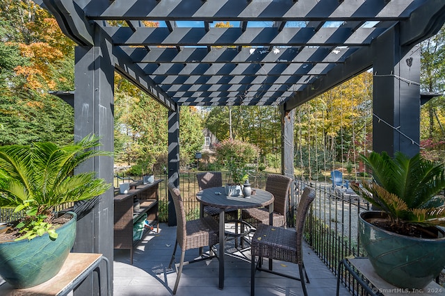 view of patio / terrace with a wooden deck and a pergola