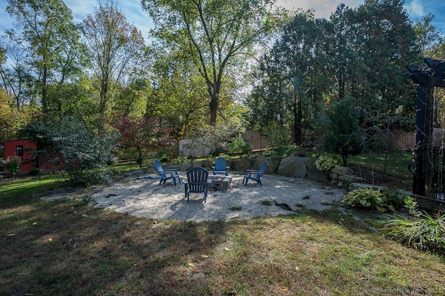 view of yard featuring a patio area and a fire pit