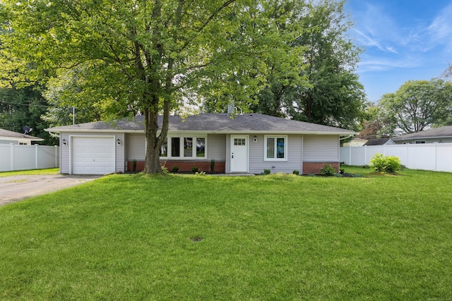 ranch-style house with a garage and a front lawn