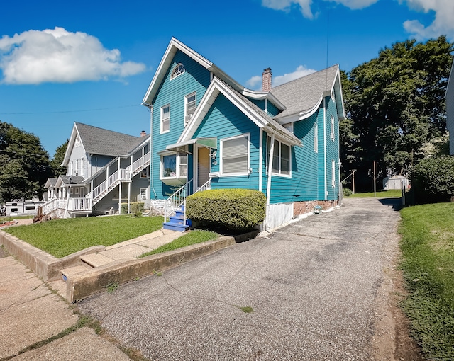 view of front of home with a front yard