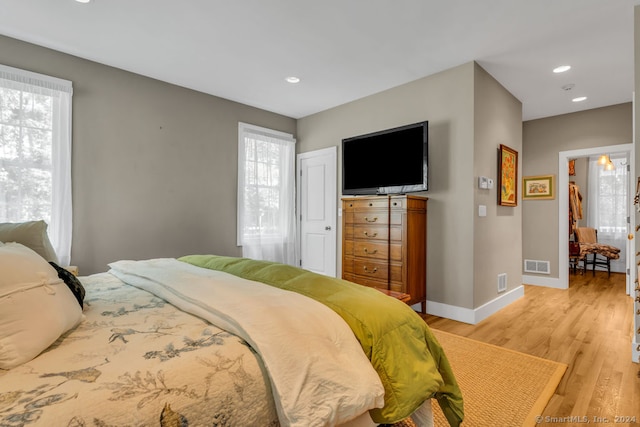 bedroom with light hardwood / wood-style flooring