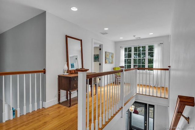 corridor featuring light hardwood / wood-style floors