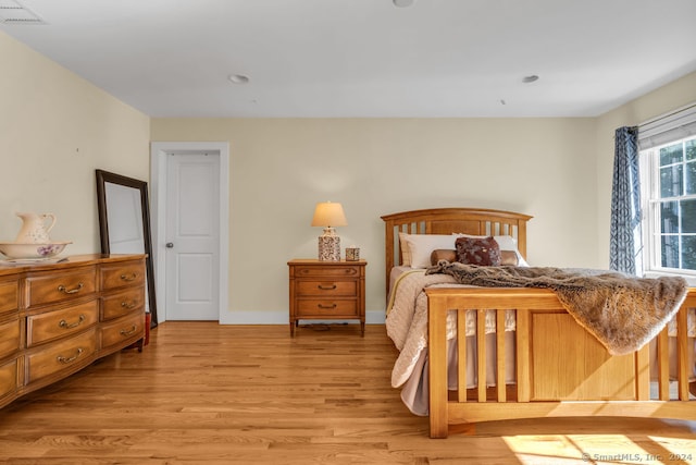 bedroom with light hardwood / wood-style floors