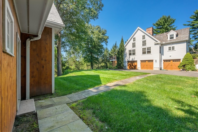 view of yard with a garage