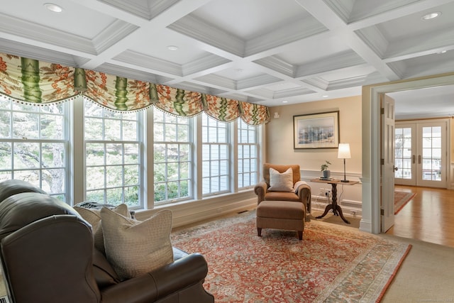 living room with coffered ceiling, beamed ceiling, wood-type flooring, and french doors