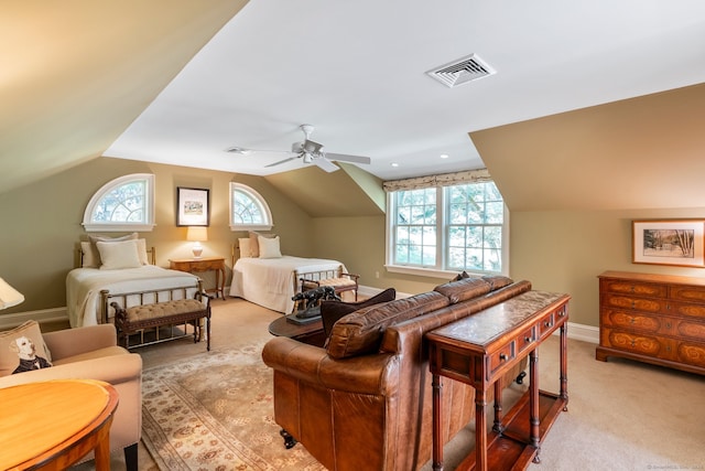 carpeted bedroom featuring vaulted ceiling and ceiling fan