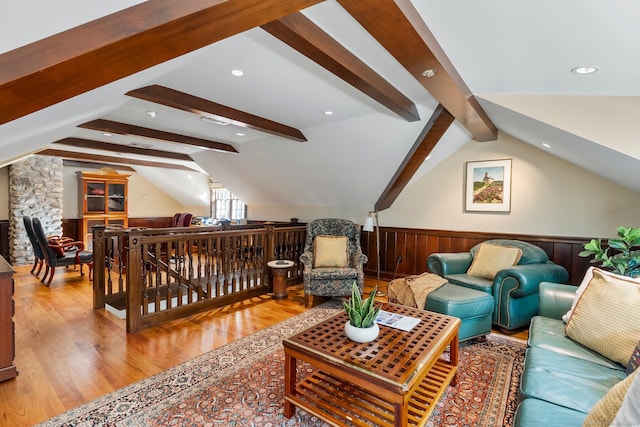 living room with light wood-type flooring and lofted ceiling with beams