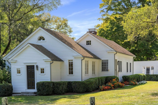 44 S St, Roxbury, CT 06783 - view of front of house with a front lawn, roof with shingles, and a chimney