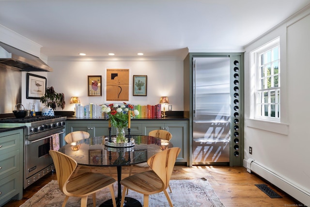 44 S St, Roxbury, CT 06783 - dining room with recessed lighting, a baseboard heating unit, ornamental molding, and light wood-type flooring
