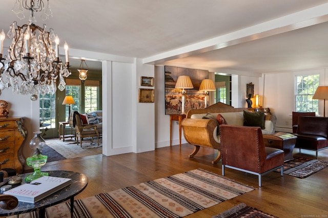 44 S St, Roxbury, CT 06783 - living room featuring an inviting chandelier, a baseboard radiator, wood finished floors, and a wealth of natural light