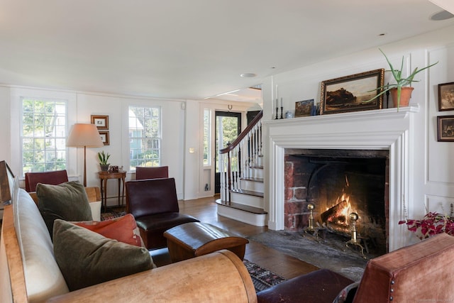 44 S St, Roxbury, CT 06783 - living area featuring a fireplace with flush hearth, stairs, and wood finished floors